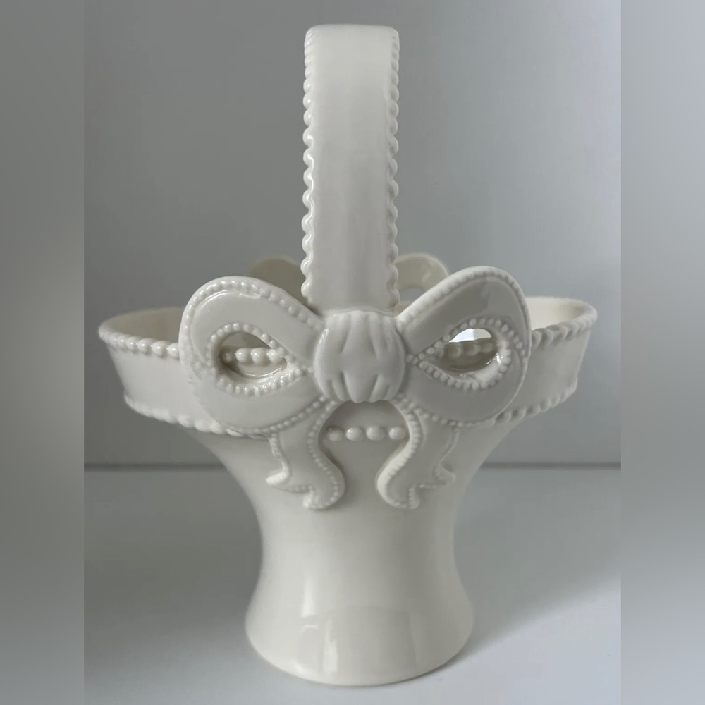 Ivory Porclain Basket with Handle and Bow  7-1/2” H x 6-1/4” W x 5-1/4” D